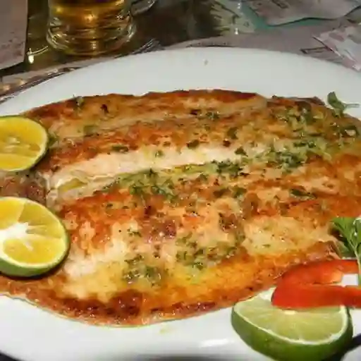 Trucha al ajillo