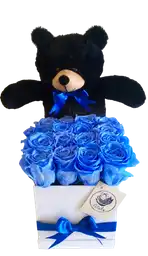 Caja deluxe blanca con rosas preservadas azules con oso de peluche negro