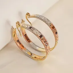Aretes Tipo Candonga Astros Tono Tres Oros Díametro 35mm - Baño Oro 18k
