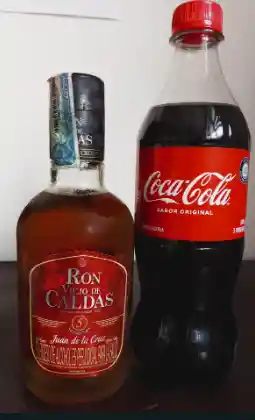 1/2 Ron Caldas + Coca-cola 600 Ml