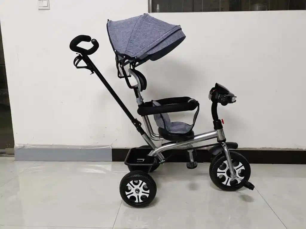 Triciclo Con Guía Bebe Niño Niña Musical Luces Paseador Gris