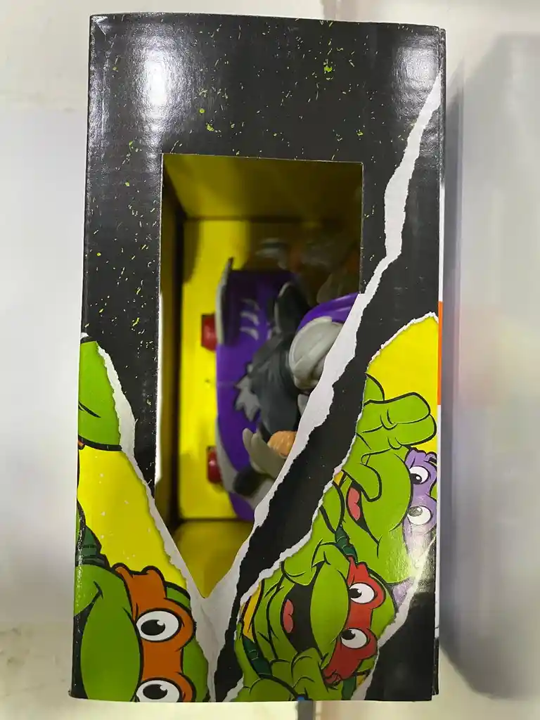 Figura Tortuga Ninja En Patineta Con Impulso Shredder