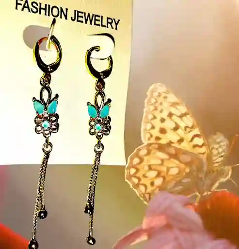 Aretes Acero Quirurjico Inoxidable Con Baño En Oro Golfi Flor Turquesa - Largos