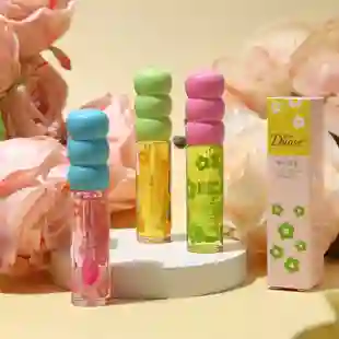 Brillo Sin Color Tipo Lip Oil Flores