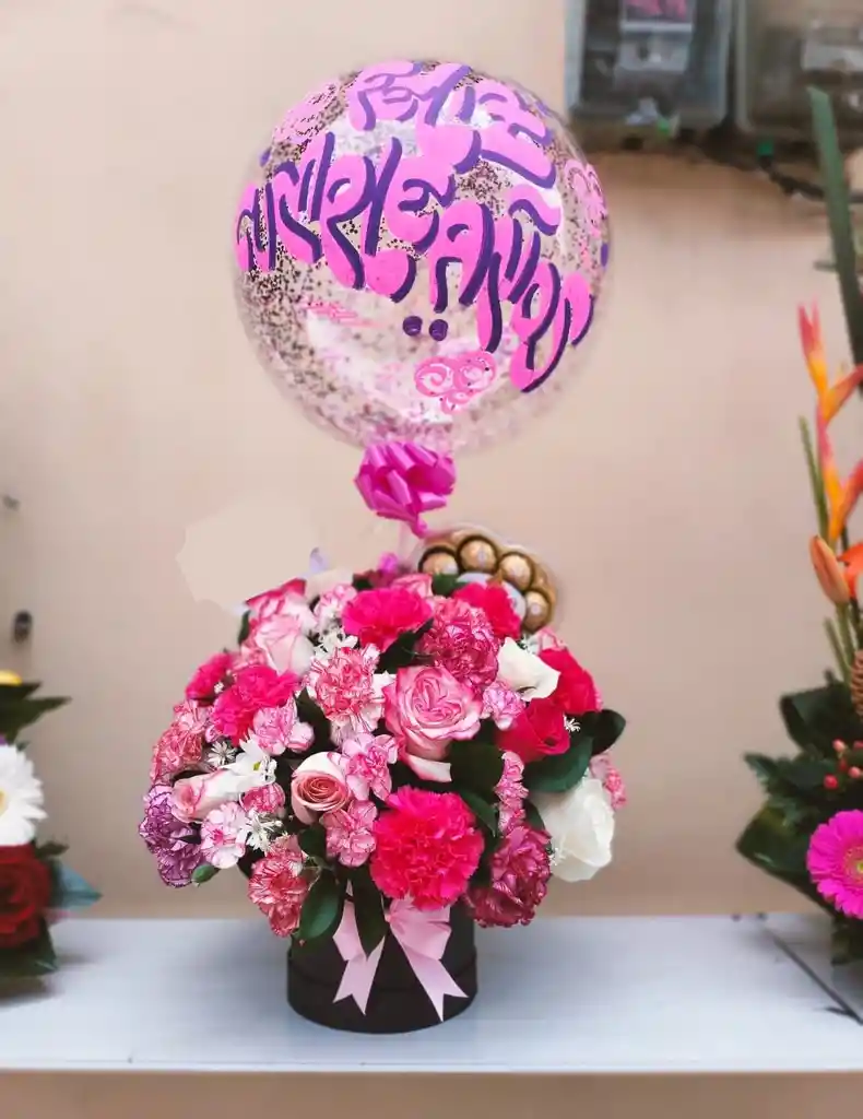 Flores Y Rosas De Colores En Base Cilindrica Con Chocolate Ferrero Y Globo