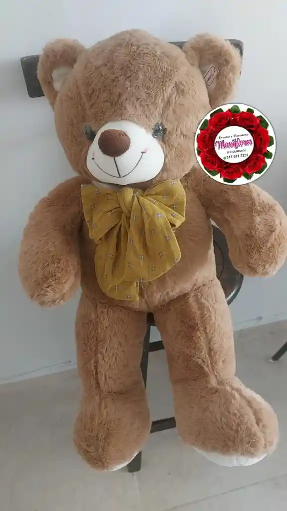 Muñeco Marron Moño Amarillo