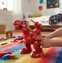 Dinosaurio Rojo Movimiento Y Luz / Lanzador Dardos.
