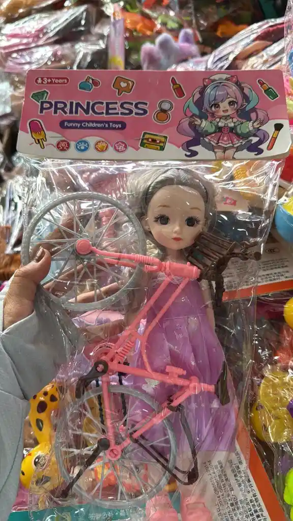 Muñeca Bebe Con Bicicleta Viene En Bolsita