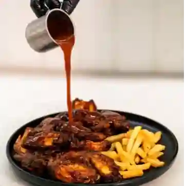 Alitas banquete del trampero