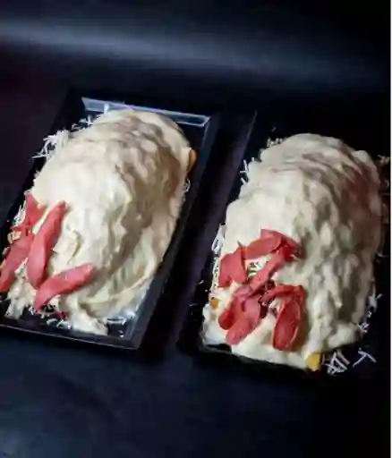 2 Salchipapas Gratinadas