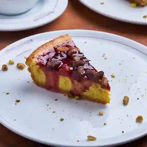 Porción Cheesecake Pistacho/Frutos Del Bosque