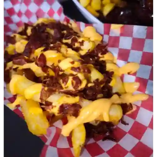 Papas + Queso Cheddar + Tocineta