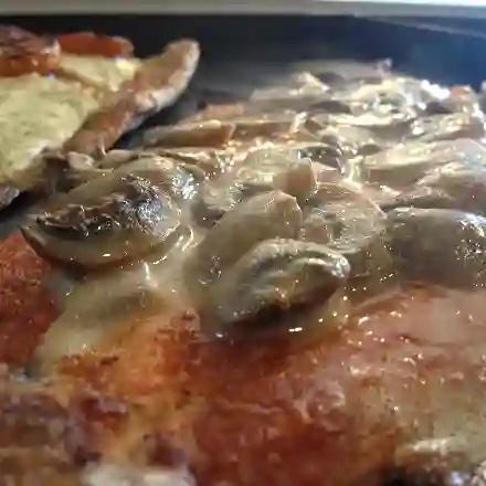 Trucha en salsa de champiñones