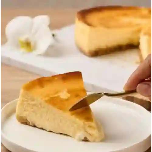Tarta de queso porción.