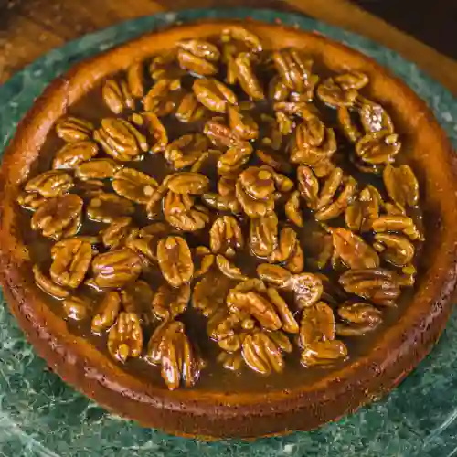 Porcion Pecan Pie Cheesecake