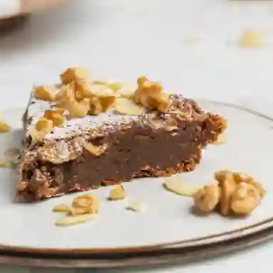 Porcion torta brownie praline