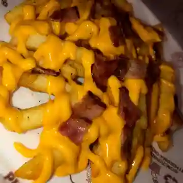 Papas + Queso cheddar+ Tocineta