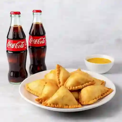 6 Empanaditas + 2 coca colas